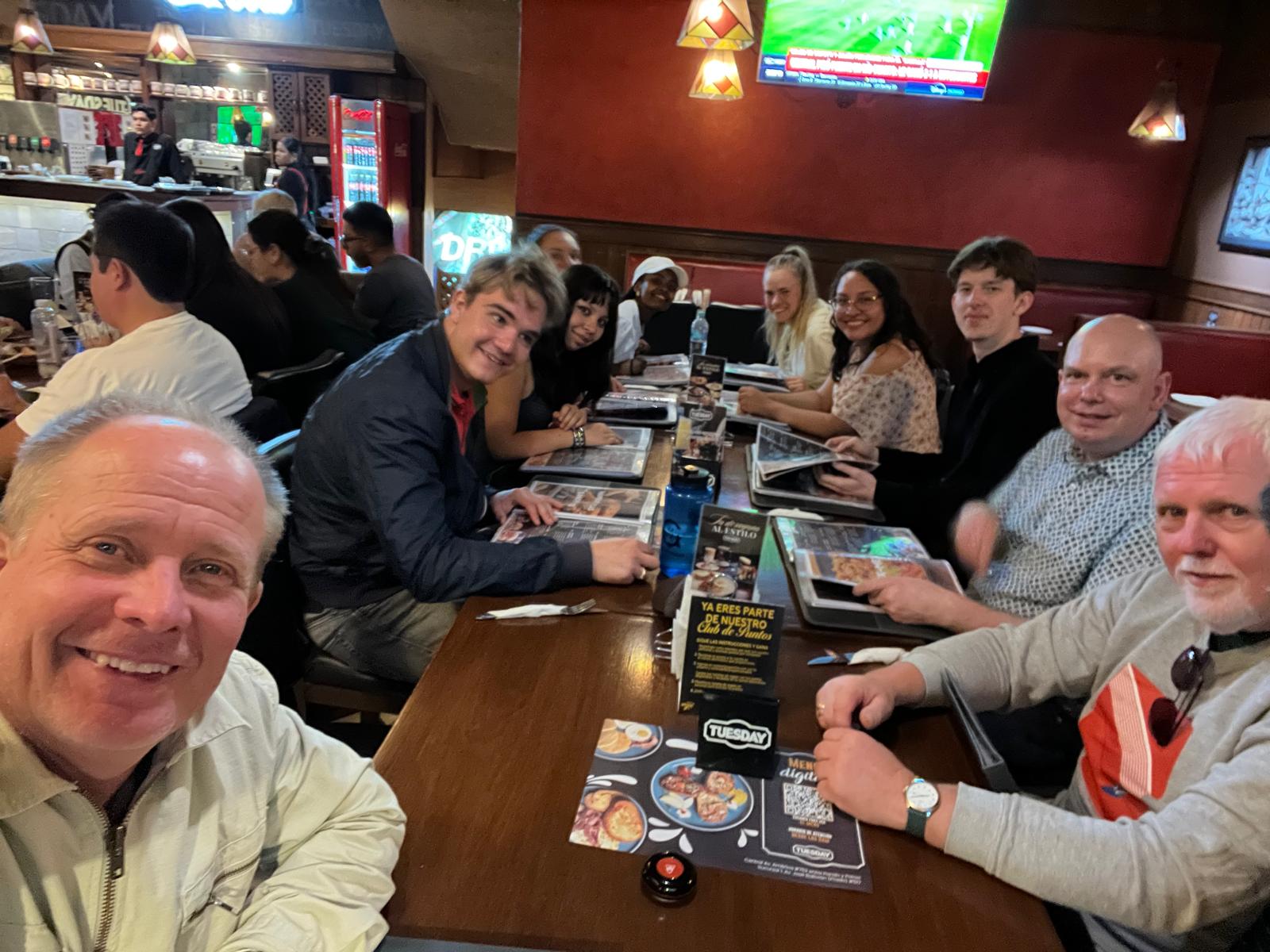 The Larsons sharing a meal with friends and family in Bolivia
