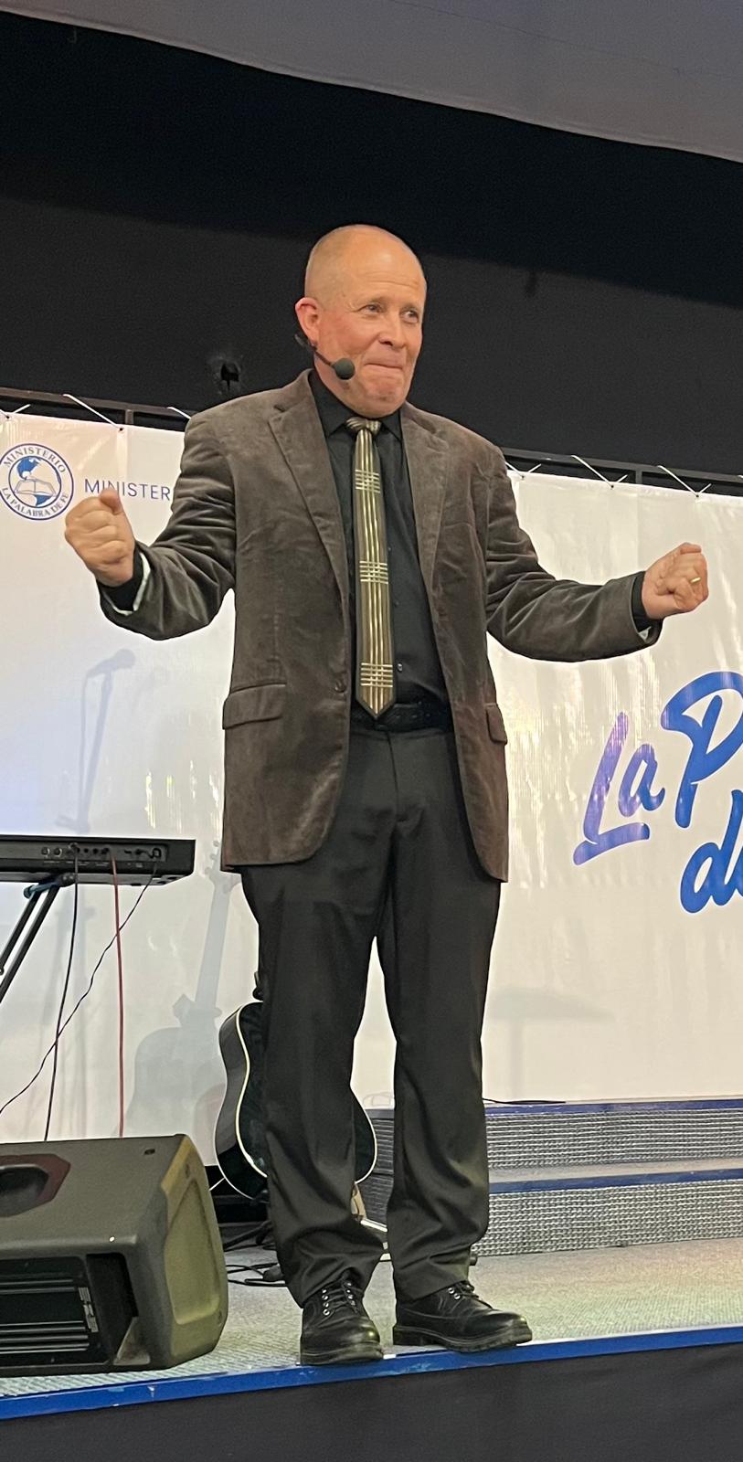 David Larson mid-message with fists raised